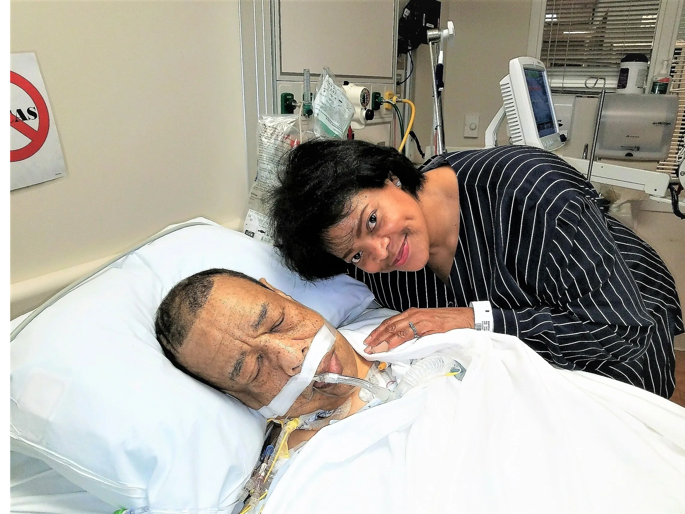 Healthcare worker with elderly patient in hospital